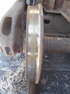 beneath the wheel flecks of new rust on the rail...